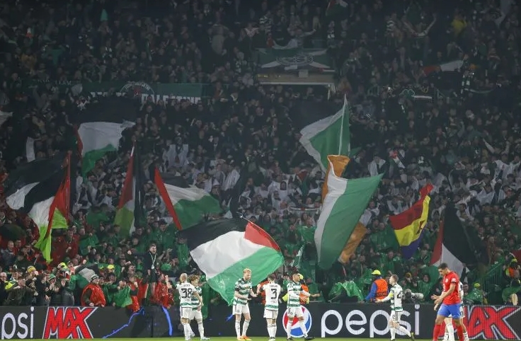 Celtic fans raise Palestinian flag at European mat